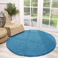 NATURL. Rund fluffig matta | Solid turkos hos Volero | Ø 120cm | Turkos | Jute | Rund | Inomhusmattor