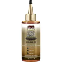 African Pride Black Castor Miracle Hair & Scalp Ttningsolja - Hrolja med Black Castor Tea Tree & Sojabnolja fr fuktlsning av hrbotten och t