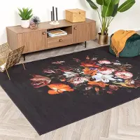 FRAAI Blommig matta | Florine svart/orange hos Volero | 160x230 cm | Polyester | Blommig | Rektangulär | Plattvävd