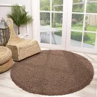 NATURL. Rund fluffig matta | Solid taupe hos Volero | Ø 100 cm | Polypropen | Enfärgad | Rund | Hög lugg