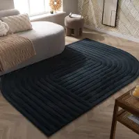 FRAAI Oregelbunden matta | Flowy Lines antracit hos Volero | 80x150 cm | Polyester | Bågar | Oregelbunden form | Hög lugg
