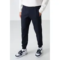 Tommy Life Herrsolid färgad sweatpants med dragkedja ficka