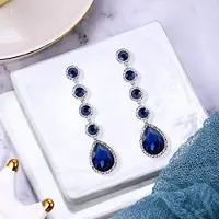 YIRAN Jewelry Caoshi Mode Temperament Dam Festörhängen Med Blå Kristall Fantastiska Accessoarer För Jubileumsceremoni Snygga Smycken